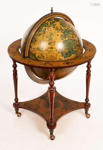 A modern terrestrial and celestial globe and stand forming a...