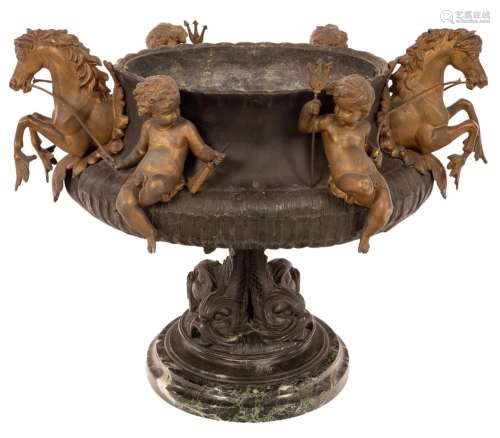A metal jardinière with applied cherubs and water horses on ...