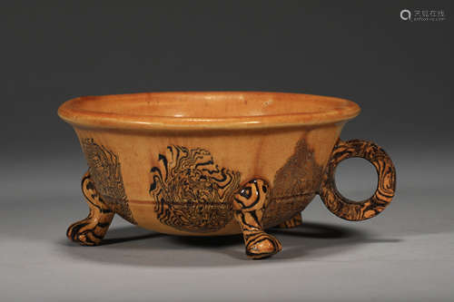 Ancient Chinese three-legged single-ear cup with twisted fet...