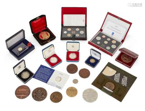 A collection of commemorative coins and medals, comprising: ...