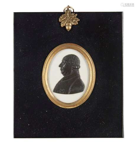 An English black paste portrait relief, possibly of George I...