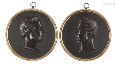 A pair of Victorian bois durci portrait roundels, attributed...