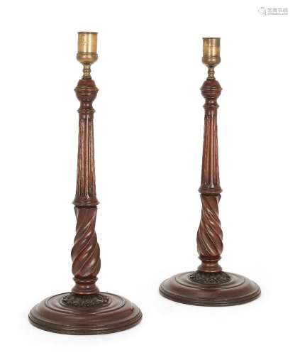 A pair of George III mahogany candlesticks, late 18th centur...