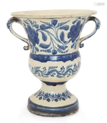 A Continental glazed pottery two-handled blue and white camp...