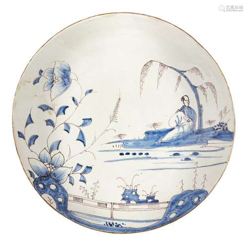 A Delft Chinoiserie charger, early 19th century, decorated w...