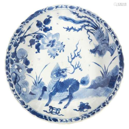 A Chinese porcelain blue and white 'kylin and phoenix' dish,...