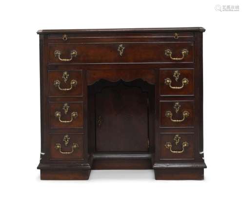 An early George III mahogany kneehole desk, with brushing sl...