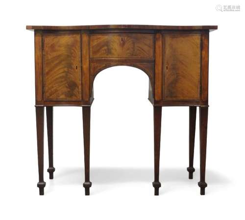 A George III mahogany and boxwood strung bow front sideboard...