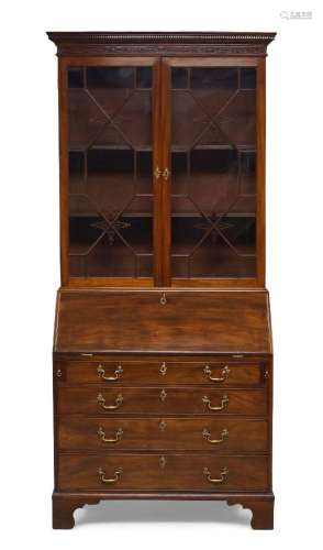 A George III mahogany bureau bookcase, circa 1760, the denti...