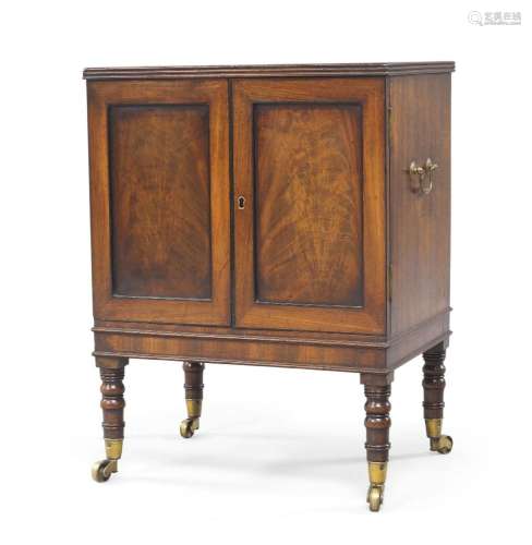 A George III mahogany two door cabinet, with brass carry han...
