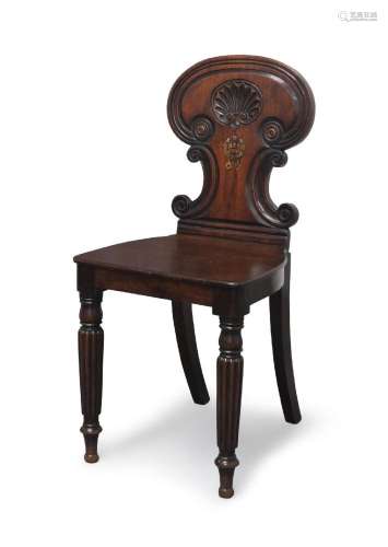 A Regency mahogany armorial hall chair in the manner of Gill...