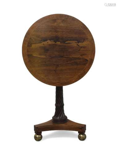 A Regency rosewood tilt-top tripod table, the circular cross...