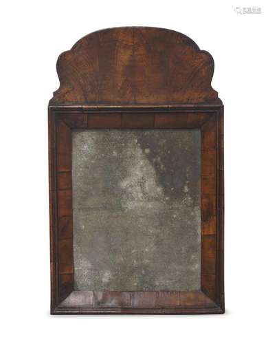 A George II walnut rectangular mirror, with scalloped shape ...