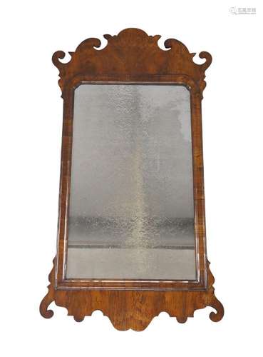 A George III walnut fret work mirror, with original glass pl...