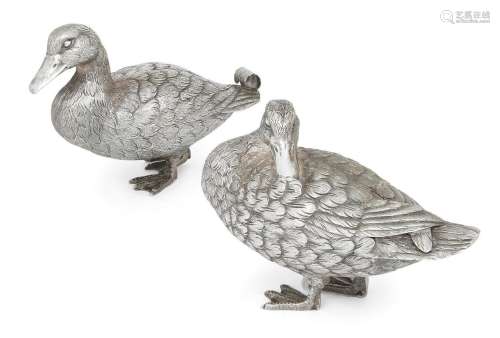 A pair of silver ducks
