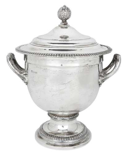 A large silver ice bucket/wine cooler