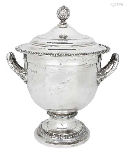 A large silver ice bucket/wine cooler