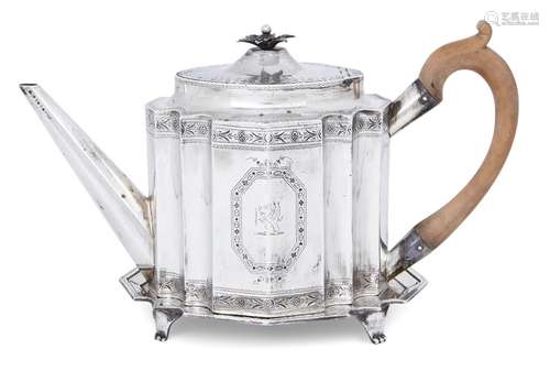 A George III silver teapot on an associated stand