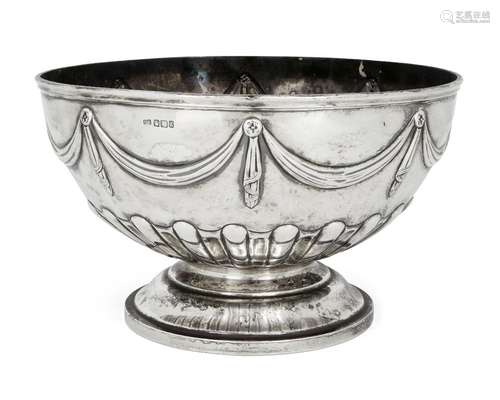 A large silver rose/punch bowl