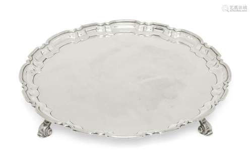 A silver salver with Chippendale style border