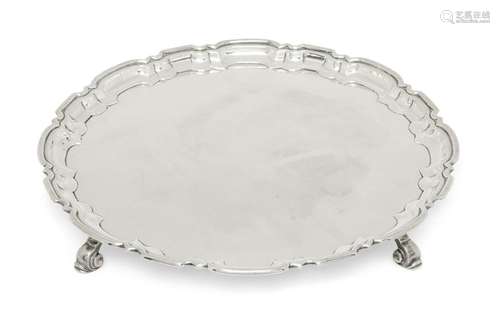 A silver salver with Chippendale style border