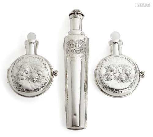 Two Victorian putti-decorated silver cased scent bottles by ...