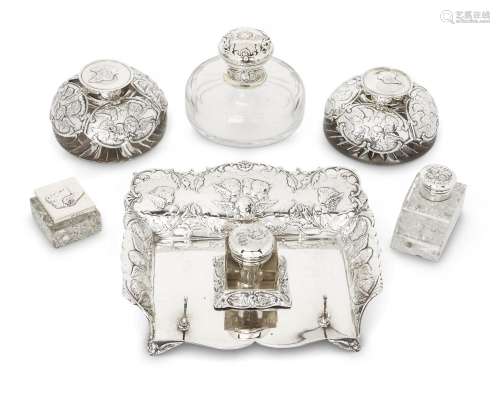 Six various putti-decorated silver mounted inkwells