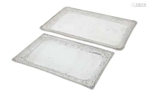 A pair of rectangular trays with pierced sides