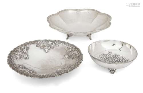 Three white metal dishes comprising: one Greek flowerhead de...