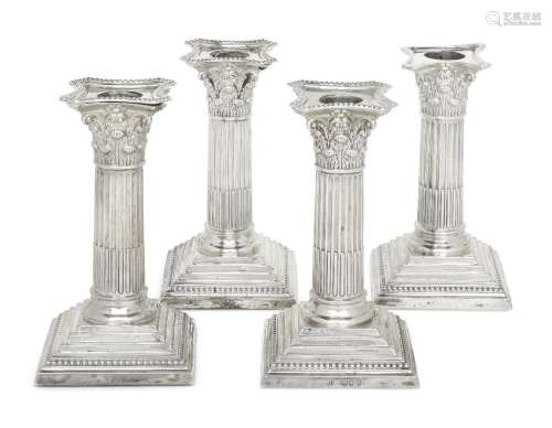 A set of four late Victorian silver candlesticks