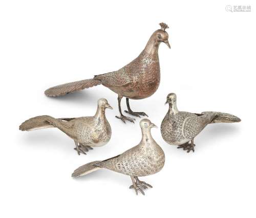 Four metal figures of birds