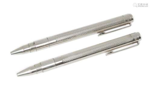 A cased pair of silver ballpoint pens