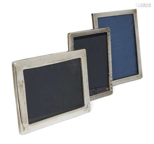 Three rectangular silver mounted photo frames