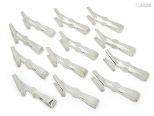 A set of twelve silver asparagus tongs