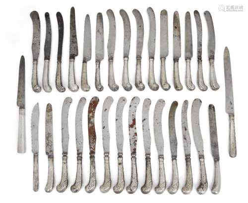 A large group of silver pistol handled table knives