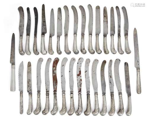 A large group of silver pistol handled table knives