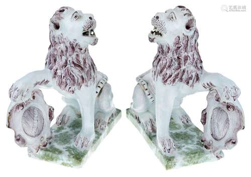 A pair of French faience armorial lions