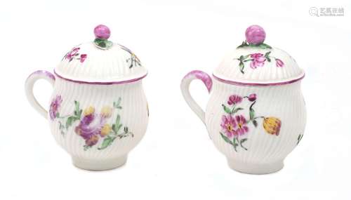 A pair of Mennecy porcelain pots jus and covers