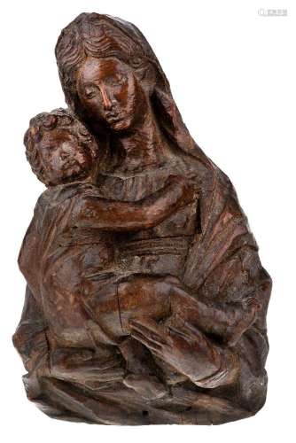 An Italian carved walnut bust length relief of the Madonna a...