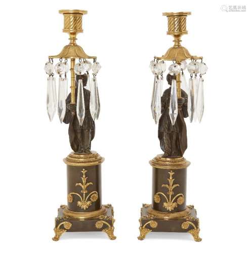 A pair of Regency gilt and patinated bronze Chinoiserie styl...