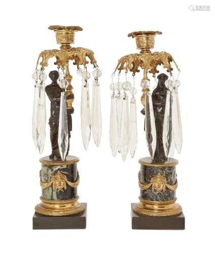 A pair of Regency gilt-metal and patinated bronze candlestic...