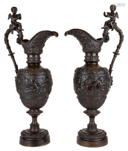 A pair of French bronze ewers