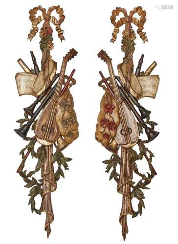 A pair of Continental polychrome decorated musical wall trop...