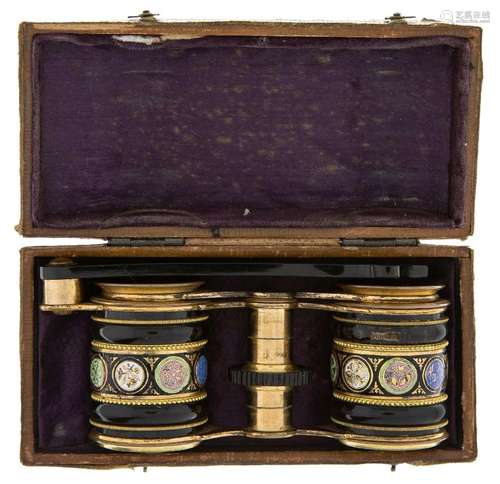 A pair of gilt-brass and black enamelled opera glasses