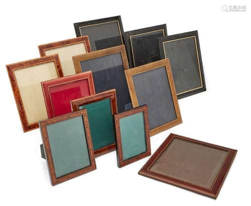 A group of eight leather and veneered photograph frames