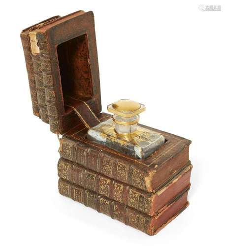 A gilt-tooled leather novelty book decanter case