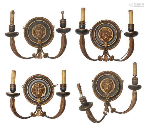 A set of four Regency black and gilt painted twin branch wal...