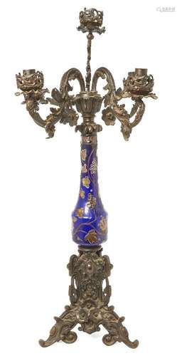 A Victorian patinated bronze and glass four-light candelabru...