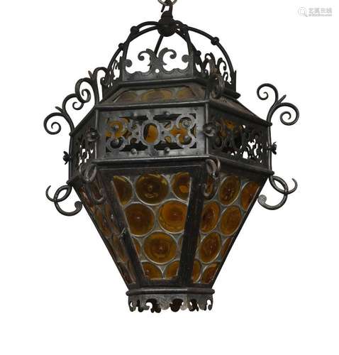 An Edwardian wrought iron hexagonal hanging lantern