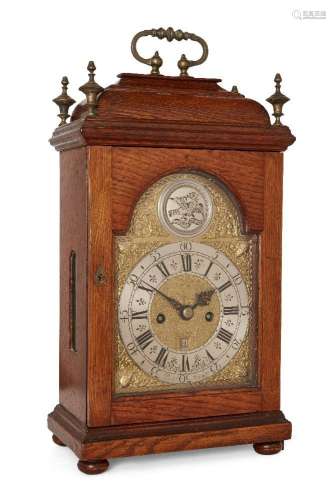 An oak striking table clock